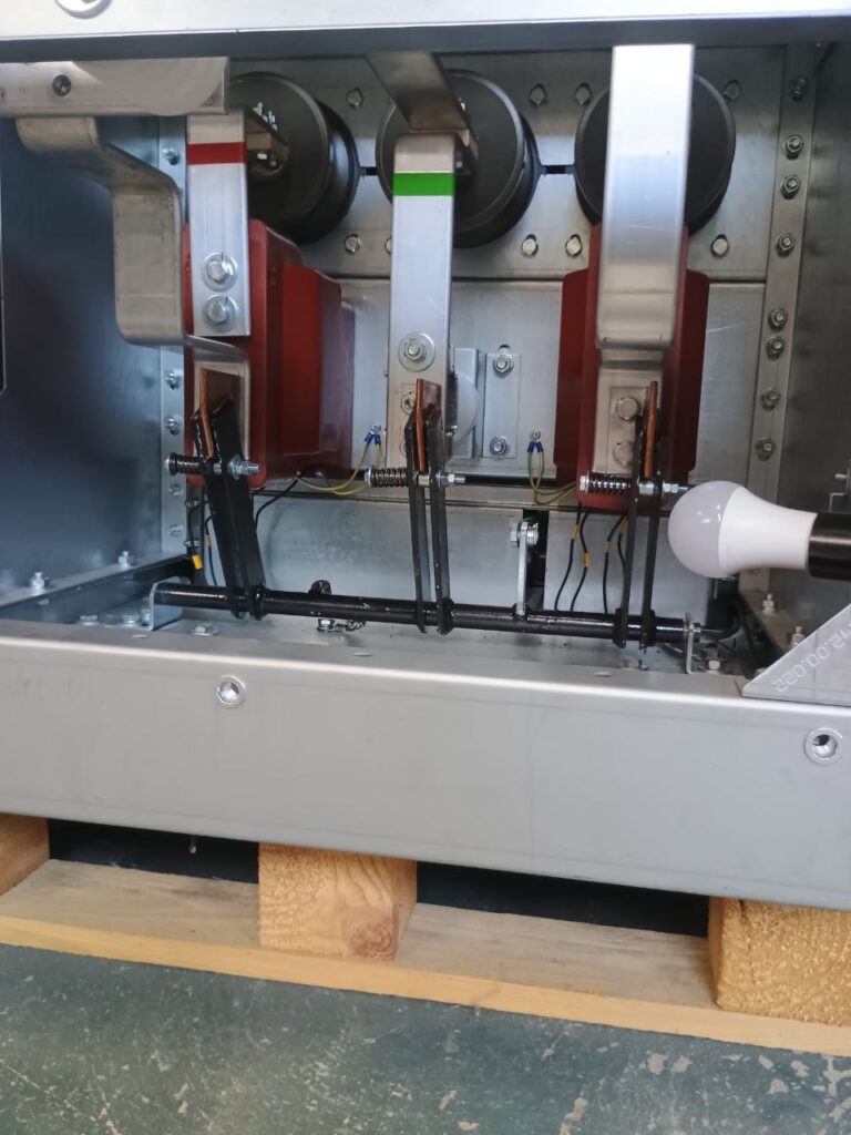 Main busbars and bushing insulators inside a 6–10 kV switchgear compartment