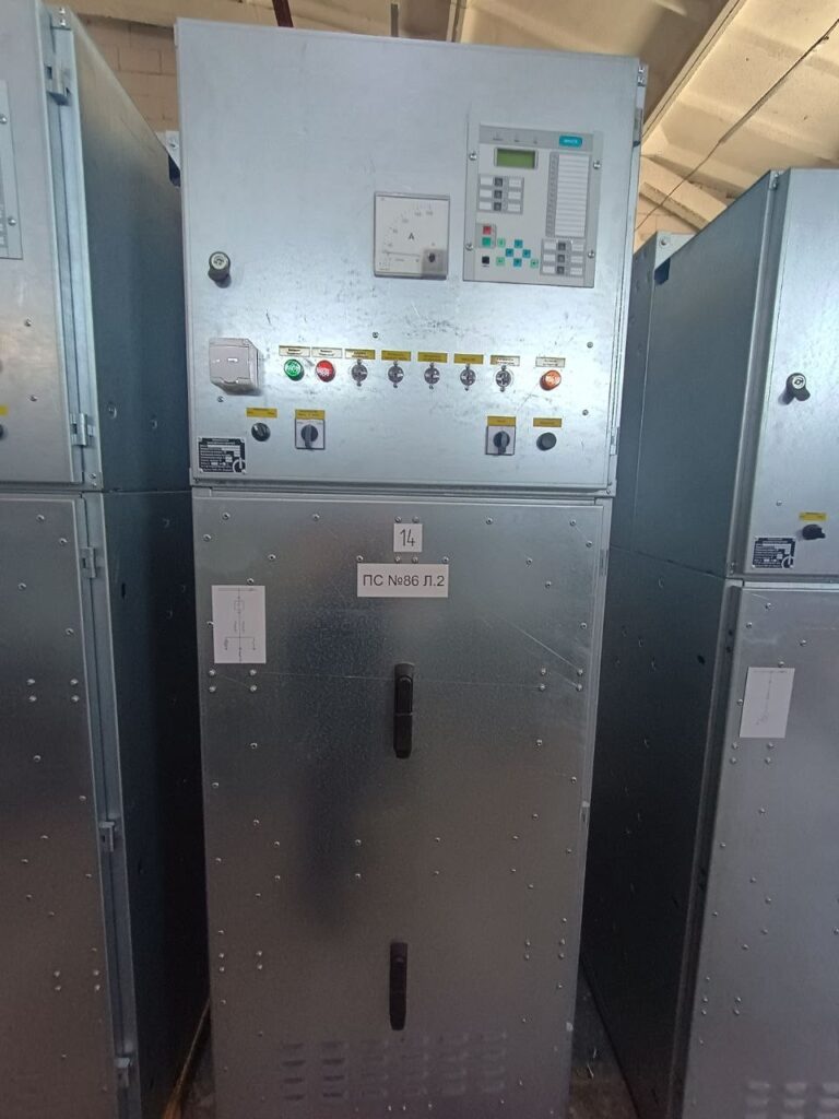 Outgoing line switchgear cabinet with microprocessor protection relay and ammeter in workshop