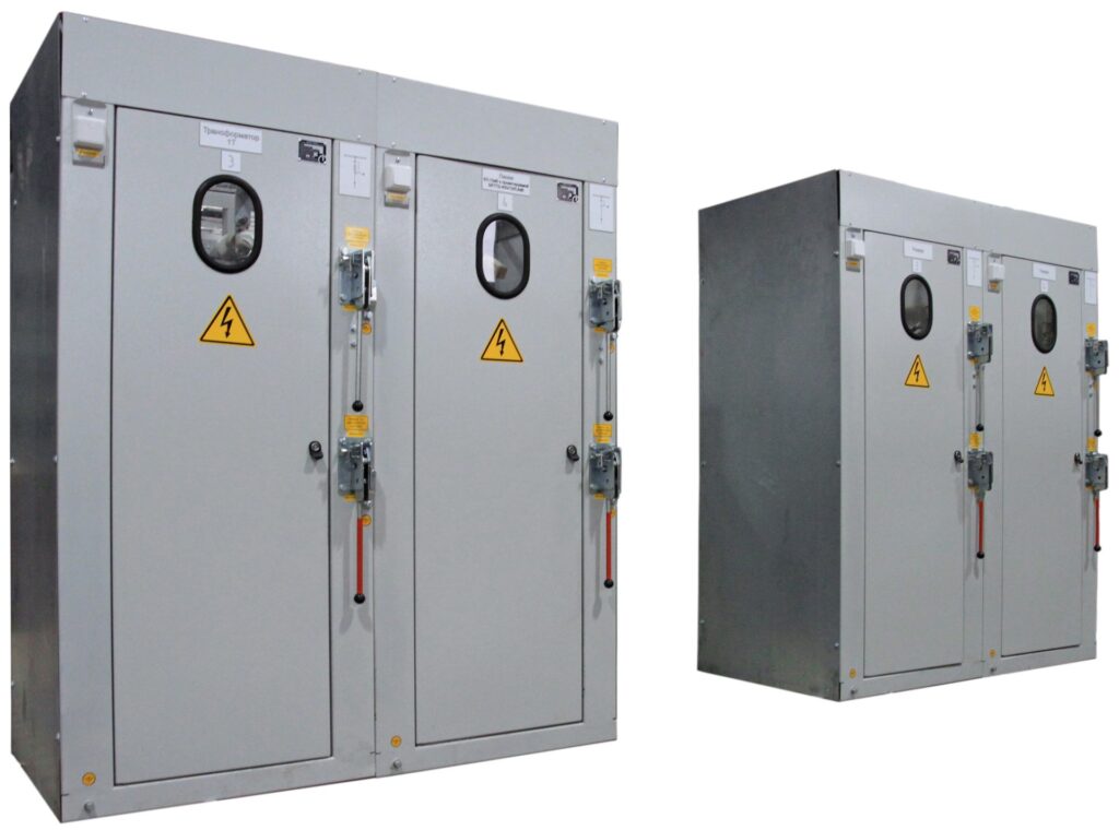 Paired switchgear cabinets with inspection windows and disconnector operating handles