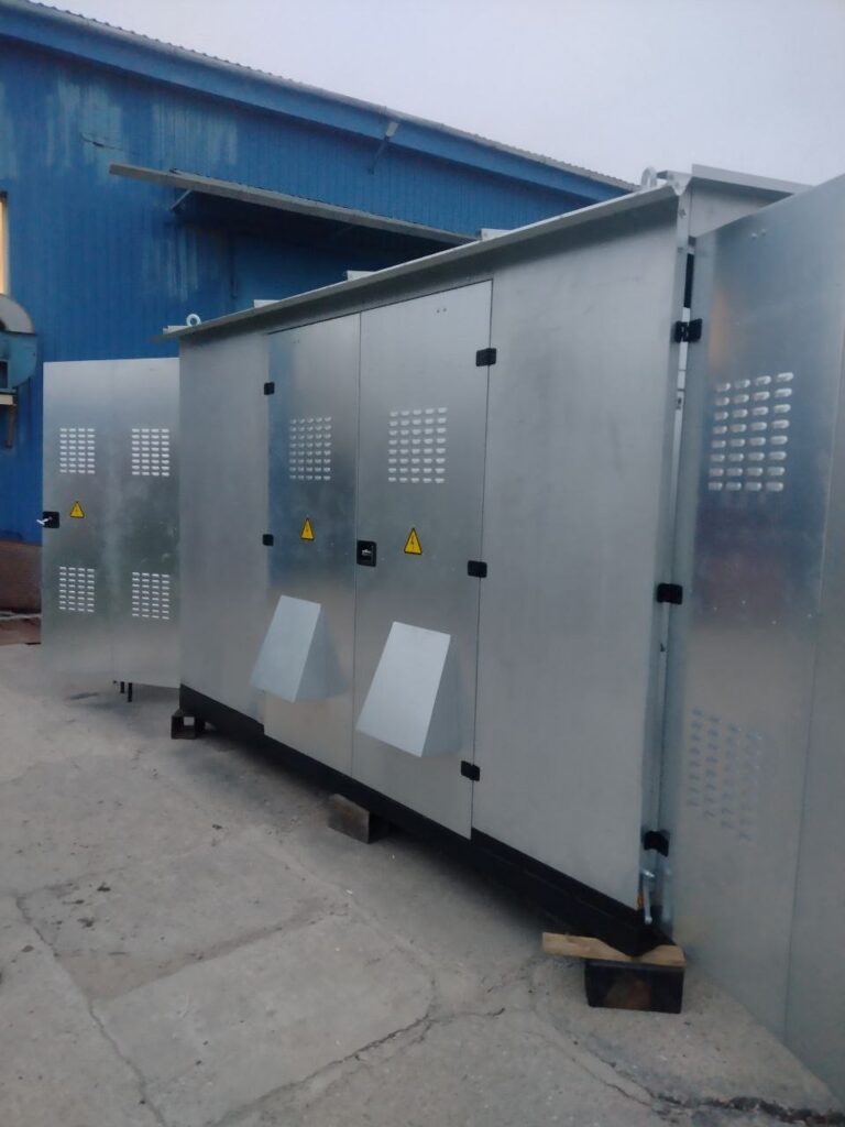 Galvanized enclosure of packaged transformer substation with ventilation louvers at factory yard
