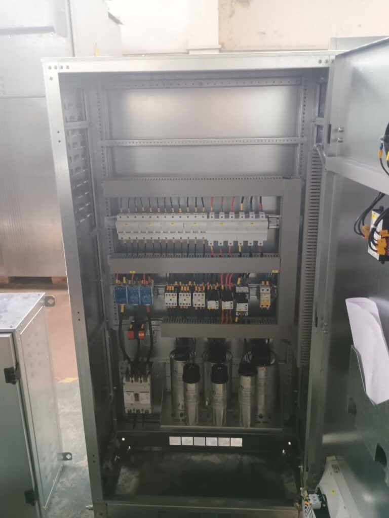 Internal assembly of a 0.4 kV capacitor bank with breakers, contactors and capacitors