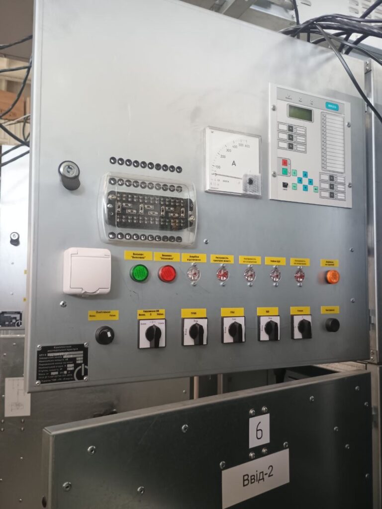 Front panel of an incoming switchgear cell with ammeter, protection relay and control switches