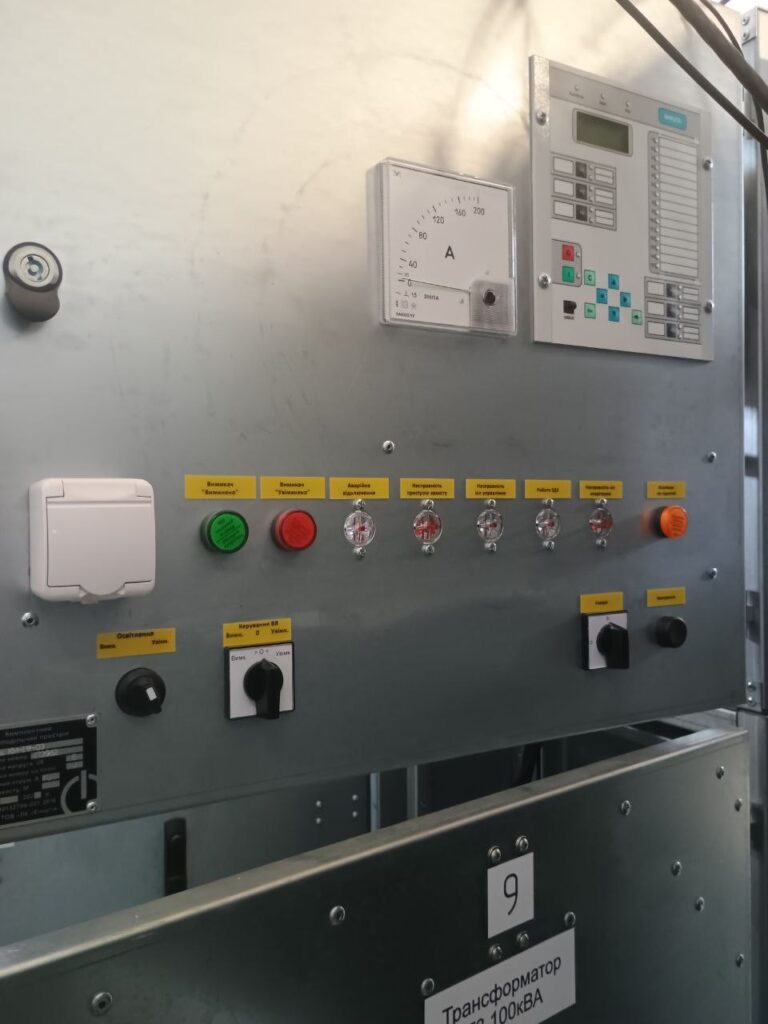 Front panel of a 100 kVA transformer cell with ammeter and relay protection unit