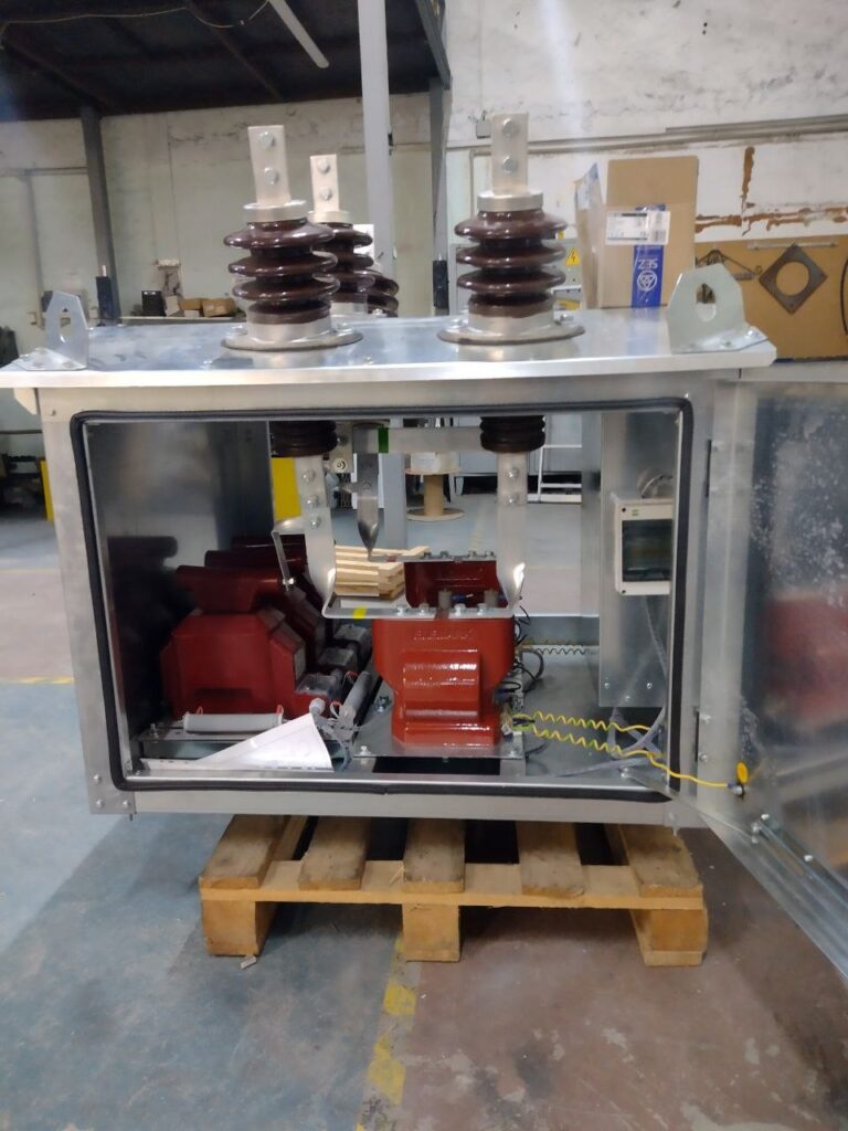 Metal enclosure with 6-10 kV bushing insulators and cast-resin transformers inside