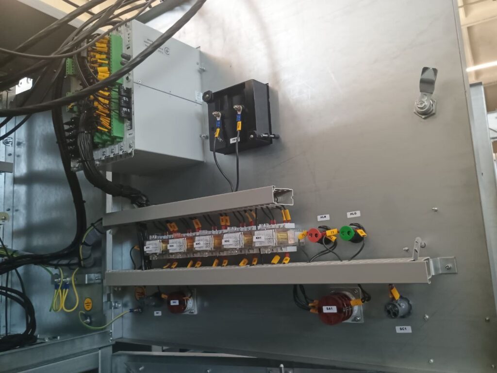Secondary circuit wiring: auxiliary relays, terminal rows and indicator lamps on panel