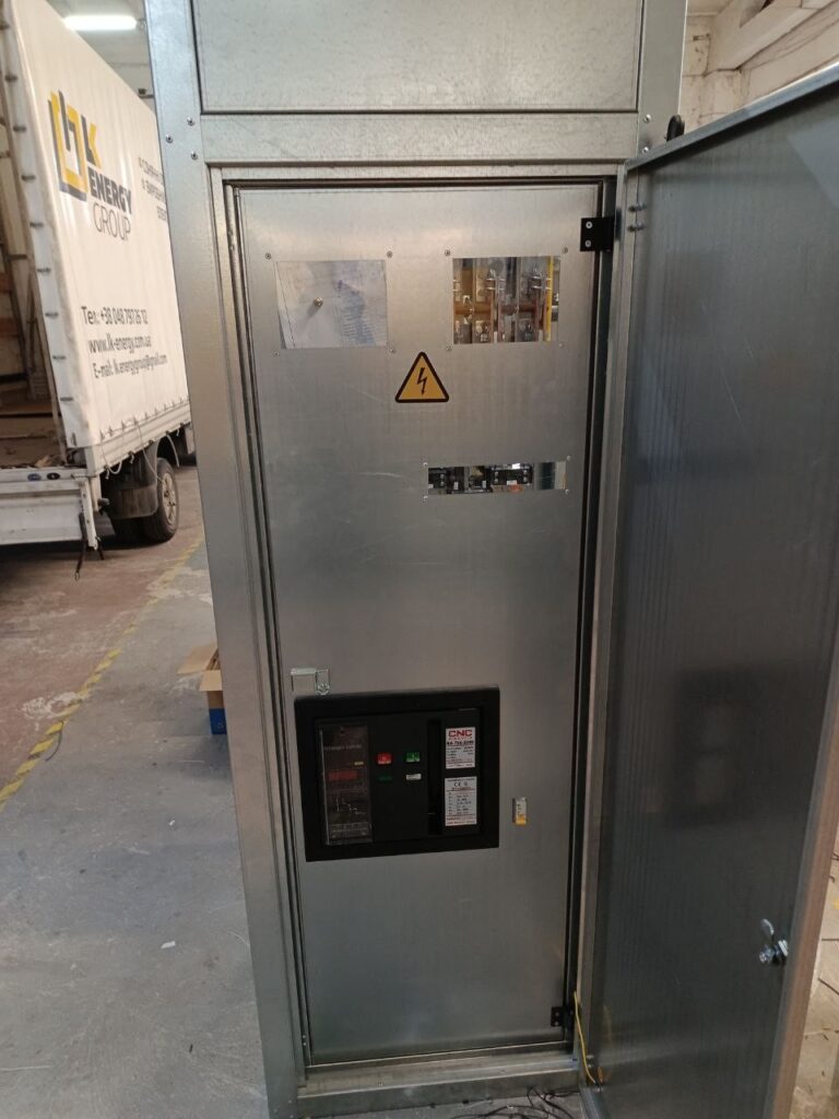 Floor-standing electrical cabinet with controller and inspection windows manufactured by LK Energy