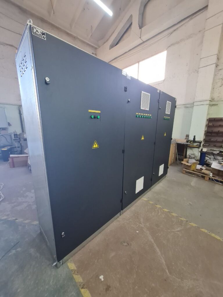 Distribution switchgear in dark metal enclosure with door-mounted indicators and control buttons