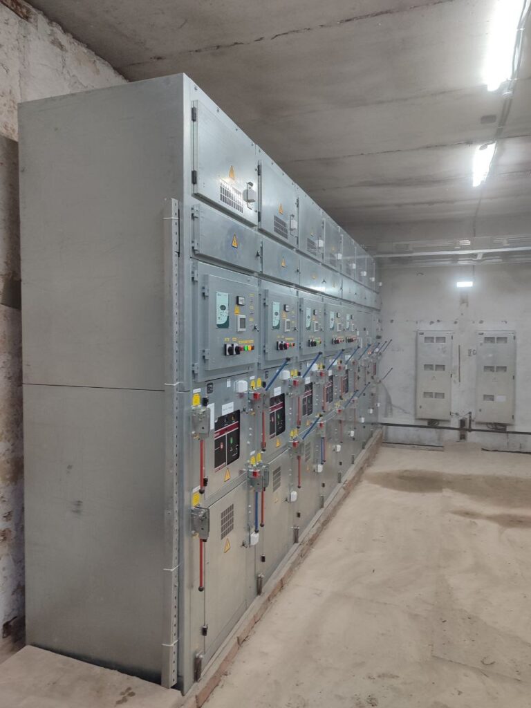 Row of switchgear cubicles installed in a distribution point room