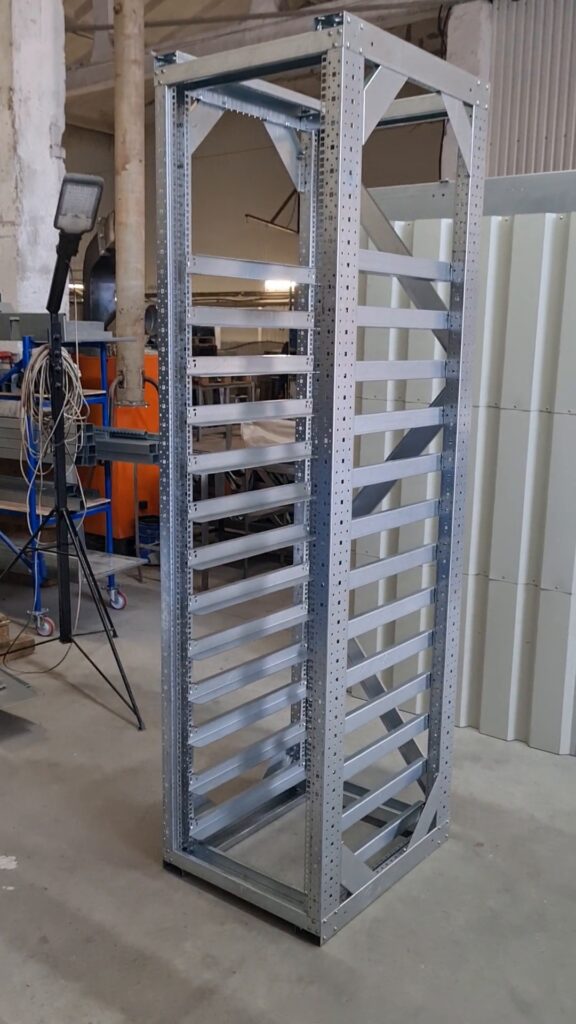 Assembled galvanized steel frame of floor-standing electrical enclosure in workshop