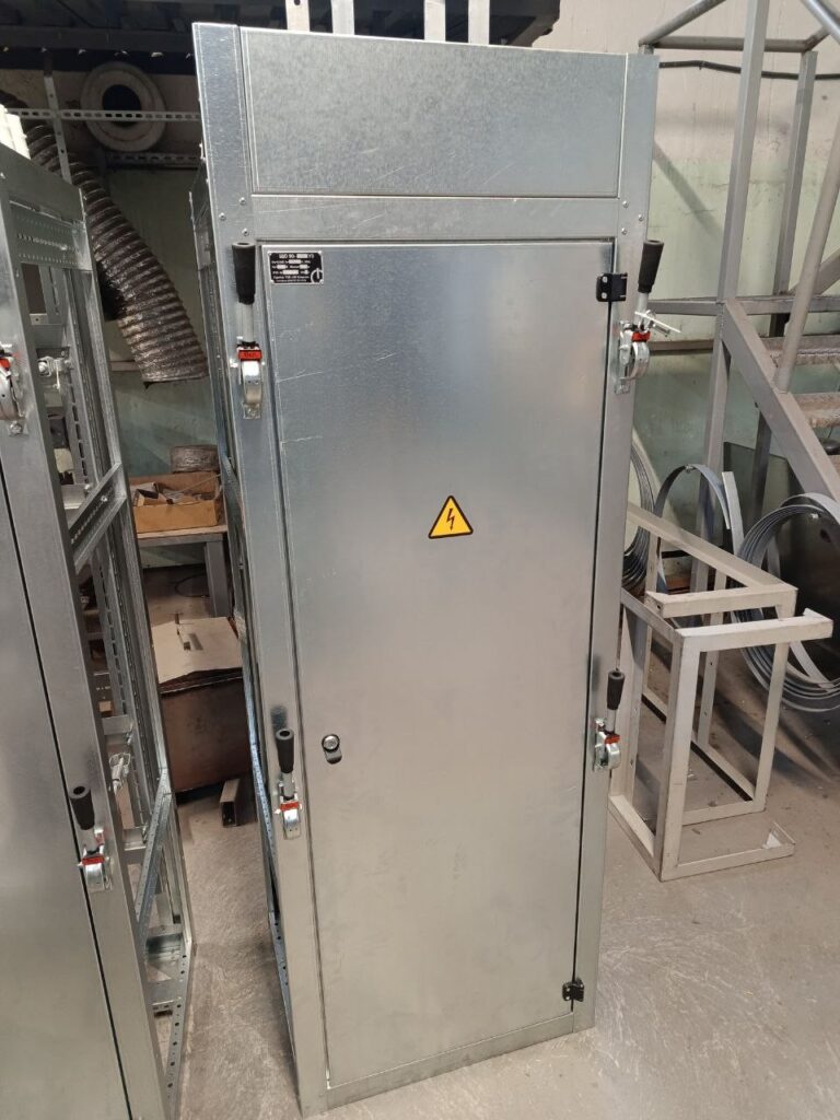 Galvanized distribution cabinet with solid door and lever drives in workshop