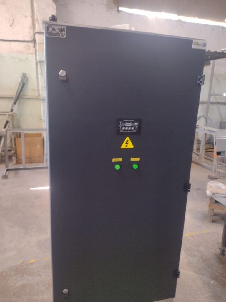 Dark grey electrical cabinet with indication panel and green signal lamps