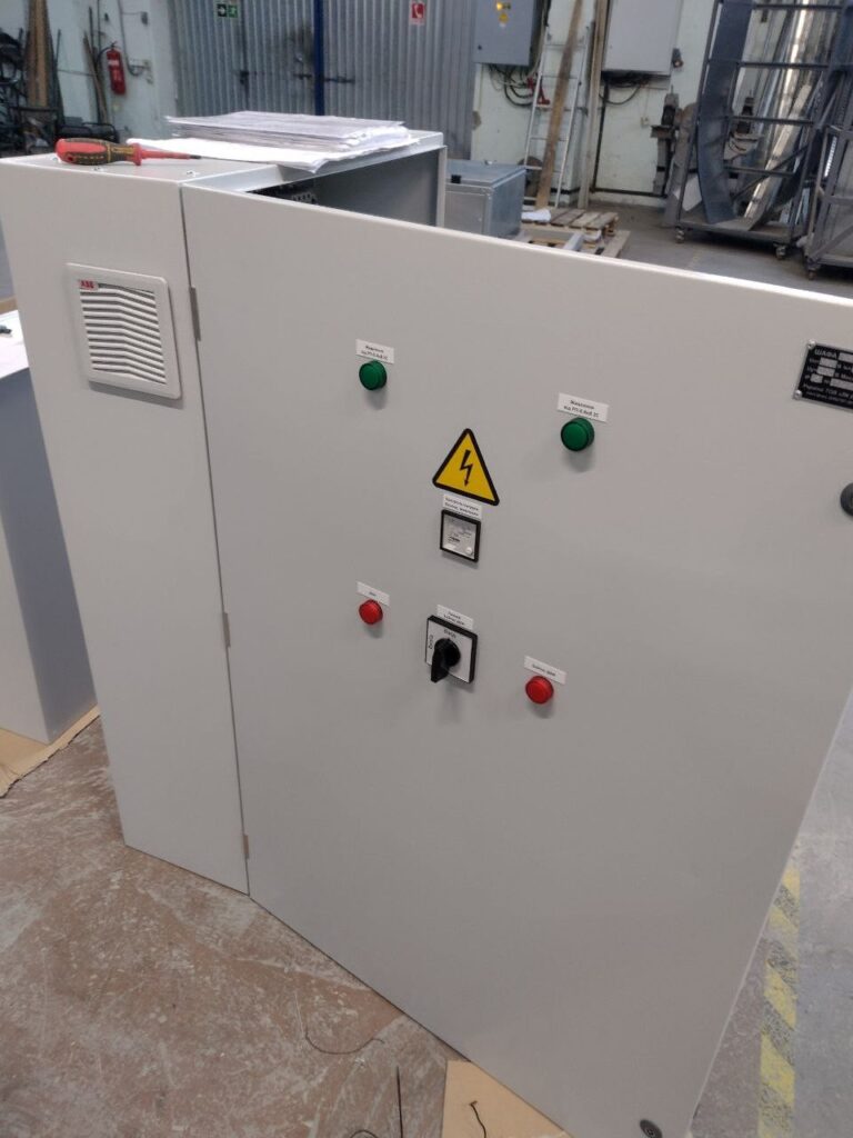 Control cabinet with start and stop buttons, selector switch and ventilation filter