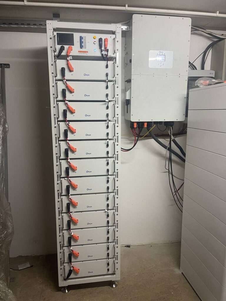 Battery energy storage system with Deye battery rack and wall-mounted hybrid inverter