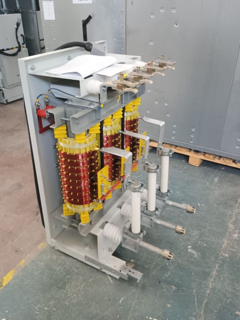 Three-phase dry-type transformer with copper windings on frame in production workshop