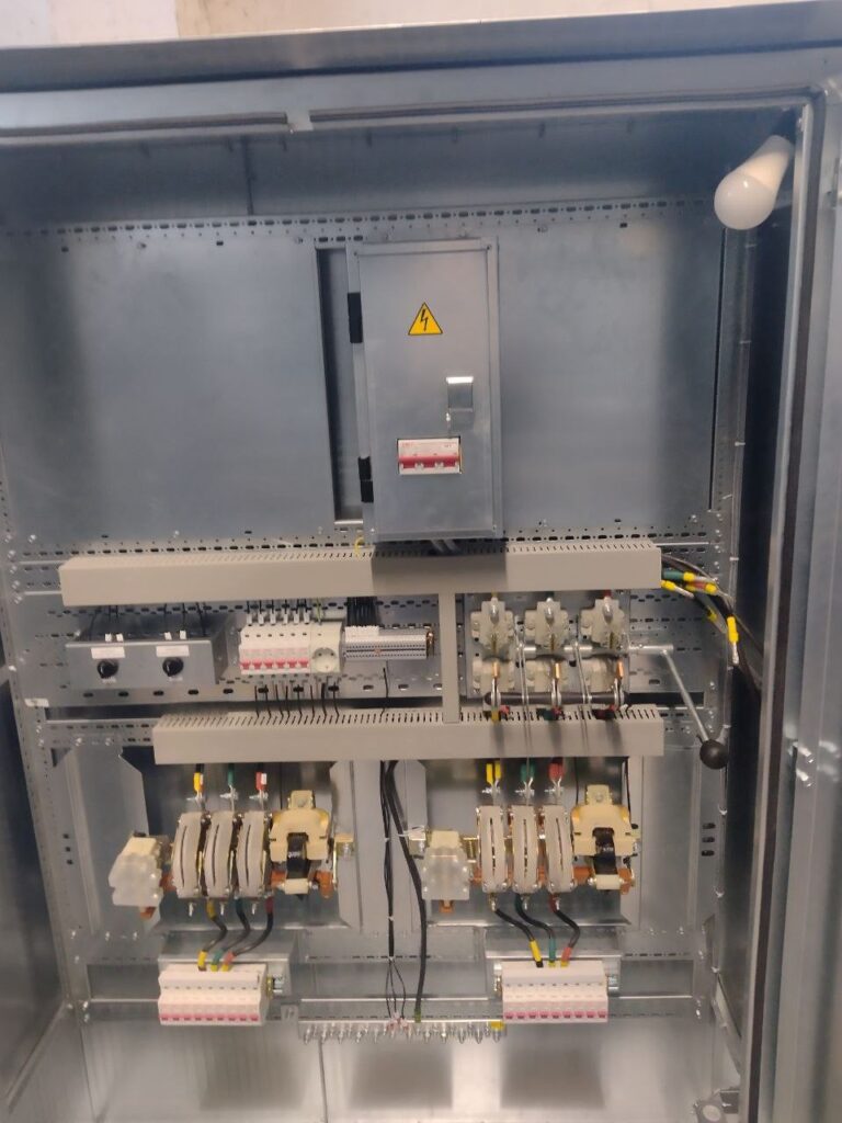 Interior of floor-standing 0.4 kV cabinet with contactors and modular circuit breakers