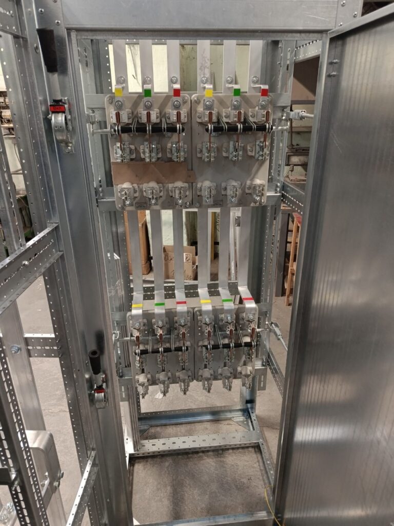 Distribution cabinet assembly stage: vertical knife switches and busbar sets, 0.4 kV