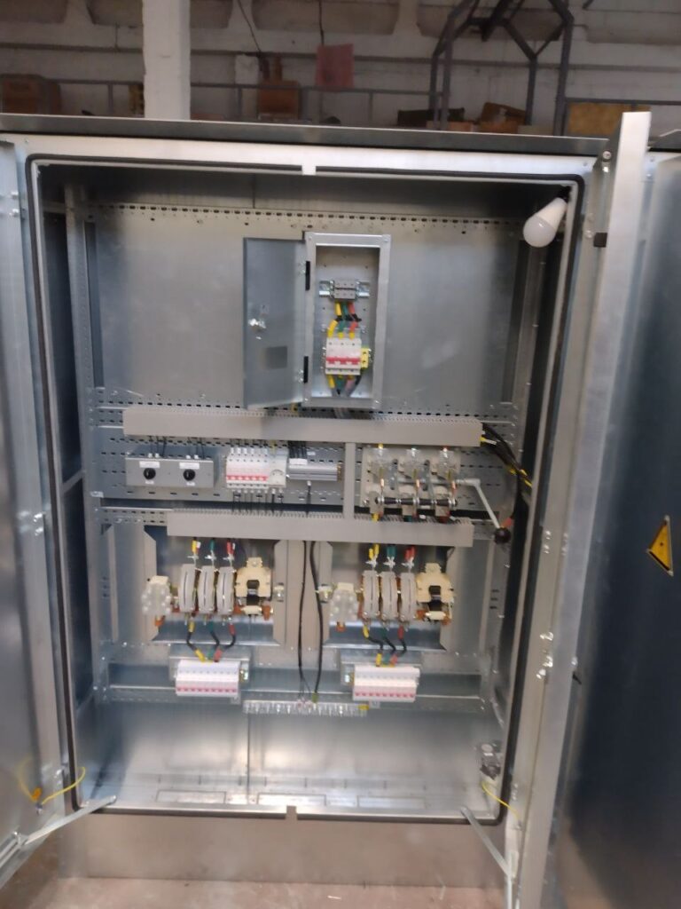 ATS cabinet during assembly: two contactor groups and modular circuit breakers